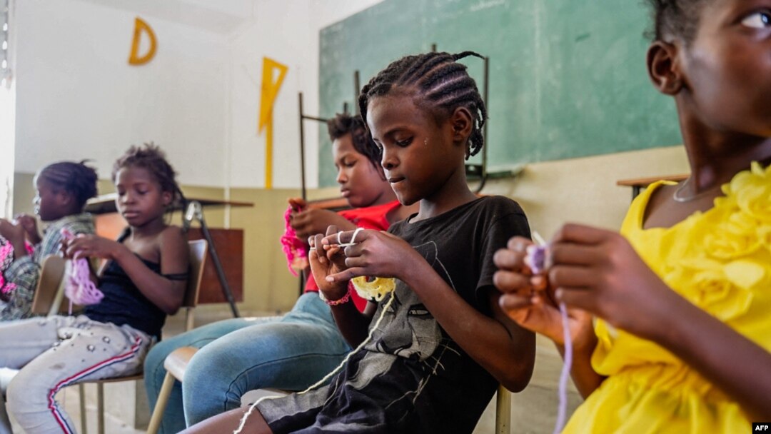 FILE - Children take refuge at a Catholic school in Port-au-Prince, Haiti, on July 30, 2022, after escaping gang violence in the Cité Soleil area.