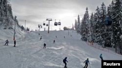 Skiers enjoy the snow on Jahorina mountain near Sarajevo, Bosnia and Herzegovina, Feb. 1, 2023. 