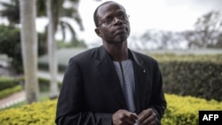 FILE - Thulani Maseko, human rights lawyer and activist, looks on as he gives an interview to Agence France-Presse in Lobamba, Eswatini, Sept. 22, 2018. 