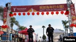 Police officers guard the area near the location of a shooting that took place during a Chinese Lunar New Year celebration, in Monterey Park, California, Jan. 22, 2023. 