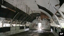 This photo is taken February 6, 2023 at the abandoned Quonset Hut, formerly used as US Marine Corps barracks, at America's largest overseas naval base in the Subic Bay Freeport Zone, Philippines It shows a concrete structure.