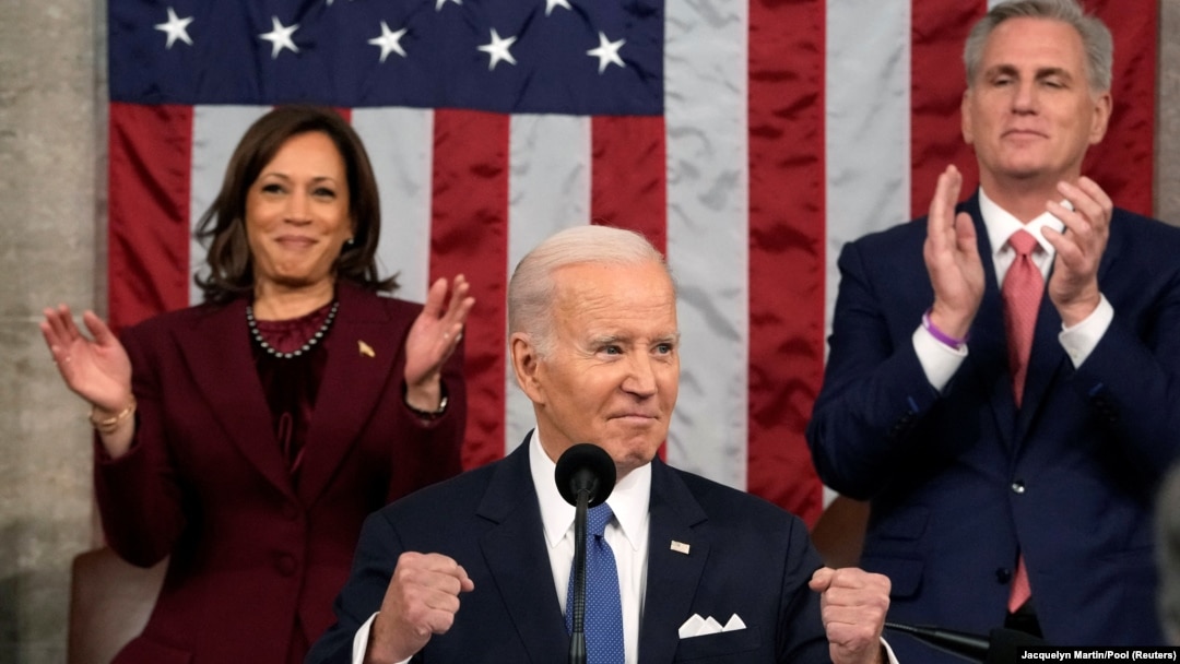 U.S. President Joe Biden delivers the State of the Union in the U.S. Capitol, Feb. 7, 2023, in Washington, as Vice President Kamala Harris and House Speaker Kevin McCarthy of California, applaud. In addition to moments of unity, several representatives heckled the president.