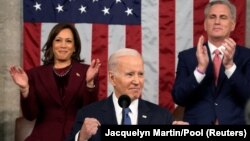 U.S. President Joe Biden delivers the State of the Union in the U.S. Capitol, Feb. 7, 2023, in Washington, as Vice President Kamala Harris and House Speaker Kevin McCarthy of California, applaud. In addition to moments of unity, several representatives heckled the president.