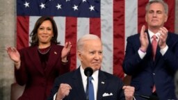 U.S. President Joe Biden delivers the State of the Union in the U.S. Capitol, Feb. 7, 2023, in Washington, as Vice President Kamala Harris and House Speaker Kevin McCarthy of California, applaud. In addition to moments of unity, several representatives heckled the president.