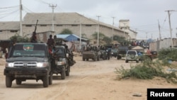 FILE - Members of the Somali National Army SNA move to their barracks in Mogadishu, Somalia, May 7, 2021.