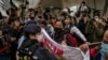 Tokoh Serikat Pekerja Hong Kong Ditangkap Setelah Kunjungi Suami di Penjara