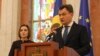 Moldovan Prime Minister designate Dorin Recean speaks after being appointed by President Maia Sandu, left, to form a new government in Chisinau, Moldova, Feb 10, 2023. 