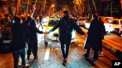 FILE - In this photo taken by an individual not employed by The Associated Press and obtained by the AP outside of Iran, demonstrators take to the streets in Tehran, Iran, on Oct. 1, 2022, to protest the death of 22-year-old Mahsa Amini.