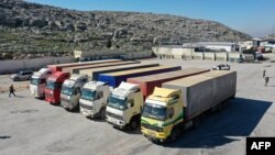 A United Nations aid convoy enters rebel-held northwestern Syria from Turkey through the Bab el-Hawa crossing on Feb. 9, 2023, the first since a devastating earthquake that killed thousands.