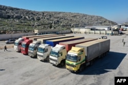 FILE - A United Nations aid convoy enters rebel-held northwestern Syria from Turkey through the Bab el-Hawa crossing on Feb. 9, 2023, the first since a devastating earthquake February 6 that killed thousands.
