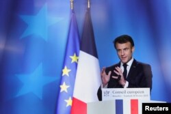 French President Emmanuel Macron gestures during a news conference at the European leaders summit in Brussels, Belgium, Feb. 10, 2023.