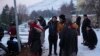 FILE - Relatives and friends of Syrian refugee Naziha Al-Ahmad bury her in a cemetery after she died during an earthquake, in Elbistan, southeastern, Turkey, Feb. 10, 2023. 