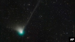 This photo provided by Dan Bartlett shows comet C/2022 E3 (ZTF) on Dec. 19, 2022. It last visited during Neanderthal times, according to NASA. (Dan Bartlett via AP)