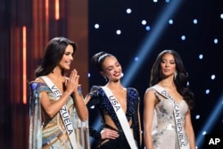The final three contestants react during the 71st Miss Universe pageant, Jan. 14, 2023. From left are Miss Venezuela Amanda Dudamel, Miss USA R'Bonney Gabriel and Miss Dominican Republic Andreína Martínez.