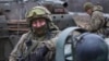 A Ukrainian soldier rests before going to the front line in Donetsk region, Ukraine, Jan. 28, 2023. 