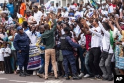 Well-wishers wave at Pope Francis in Kinshasa, Congo, Jan. 31, 2023.