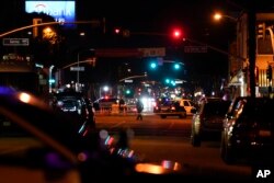 Police investigate a scene where a shooting took place in Monterey Park, California, Jan. 22, 2023.