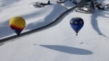Balloons take part in the 43rd International Hot Air Balloon Festival in Chateau-d'Oex, Switzerland, Jan. 24, 2023. 