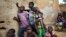 FILE—A group of displaced children gather in the court of a house in Segou on September 30, 2019.