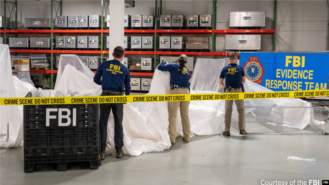 FILE - FBI special agents assigned to the Evidence Response Team process material from the high-altitude balloon recovered off the coast of South Carolina. The material was processed and transported to the FBI Laboratory in Quantico, Virginia.