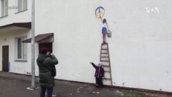 意大利艺术家用令人振奋的壁画为乌克兰城镇带来希望