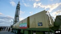 FILE - An Iranian long-range Ghadr missile displaying "Down with Israel" in Hebrew is pictured at a defense exhibition in city of Isfahan, Iran, Feb. 8, 2023.