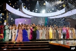 Miss USA R'Bonney Gabriel points on stage after being crowned Miss Universe at the 71st Miss Universe pageant, in New Orleans, Jan. 14, 2023.