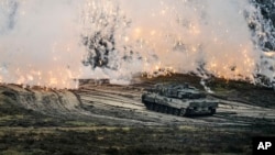 A Leopard 2 tank is seen in action during a visit of German Defense Minister Boris Pistorius at the Bundeswehr tank battalion 203 at the Field Marshal Rommel Barracks in Augustdorf, Germany, Feb. 1, 2023. 