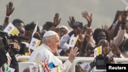 Pope Francis greets people during the Holy Mass at John Garang Mausoleum, during his apostolic journey, in Juba, South Sudan, Feb. 5, 2023. 