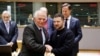 Ukraine's President Volodymyr Zelensky, center, shakes hands with High Representative of the European Union for Foreign Affairs and Security Policy Josep Borrell as part of a EU summit in Brussels, Feb. 9, 2023.