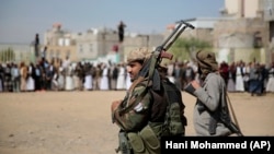 (FILE) Armed Houthi fighters in Sanaa, Yemen