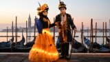 Masked revellers wearing traditional carnival costume pose during the carnival in Venice, Italy, Feb. 12, 2023.