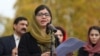 FILE - Nobel Peace Prize laureate Malala Yousafzai speaks at a rally in support of Afghan women's rights in London, Britain, Nov. 27, 2022. 