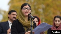 FILE - Nobel Peace Prize laureate Malala Yousafzai speaks at a rally in support of Afghan women's rights in London, Britain, Nov. 27, 2022. 