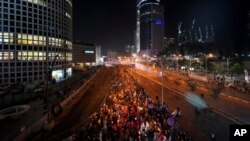 People protest Prime Minister Benjamin Netanyahu and his far-right government that his opponents say threaten democracy and freedom, in Tel Aviv, Israel, Jan. 21, 2023