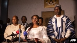 Olivia Rouamba (C), Burkina Faso's Minister of Foreign Affairs, speaks during a joint press conference with Morissanda Kouyaté (L), Minister of Foreign Affairs of Guinea and Abdoulaye Diop (R), Minister of Foreign Affairs of Mali, in Ouagadougou, on February 9, 2023. 