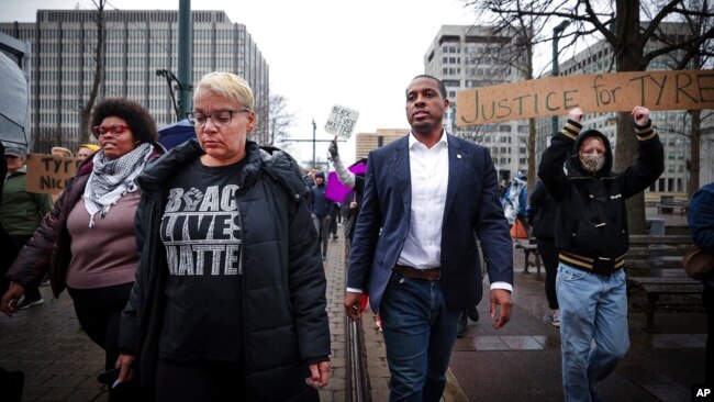 Memphis City Councilman JB Smiley Jr., center, marches with local activists demanding justice for Tyre Nichols, who died after being beaten by Memphis police during a traffic stop, in Memphis, Tenn., on Jan. 28, 2023.