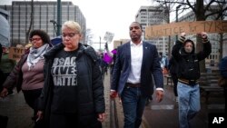 Memphis City Councilman JB Smiley Jr., center, marches with local activists demanding justice for Tyre Nichols, who died after being beaten by Memphis police during a traffic stop, in Memphis, Tenn., on Jan. 28, 2023. 