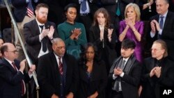RowVaughn Wells, center, mother of Tyre Nichols, who died after being beaten by Memphis police officers, and her husband Rodney Wells, second left, are recognized by U.S. President Joe Biden as he delivers his State of the Union speech in Washington, Feb. 7, 2023.