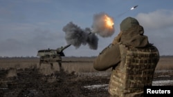 A Ukrainian army artillery brigade fires a German howitzer Panzerhaubitze 2000 near Bahmut, in Donetsk region, Ukraine, Feb. 5, 2023.
