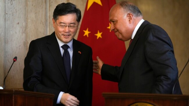 Egyptian Foreign Minister Sameh Shoukry, right, greets his Chinese counterpart, Qin Gang, following their press conference at the foreign ministry headquarters in Cairo, Egypt, Jan. 15, 2023.