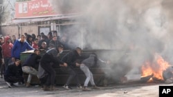 Palestinians clash with Israeli forces following an army raid in the West Bank city of Jenin, Jan. 26, 2023. Israeli forces killed at least nine Palestinians, including a 60-year-old woman, and wounded several others during a raid.