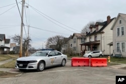 An Ohio State Trooper car sits parked next to a blockade in East Palestine, Feb. 7, 2023.