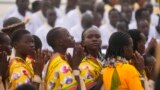 People pray as Pope Francis celebrates Mass at the John Garang Mausoleum in Juba, South Sudan, Feb. 5, 2023.