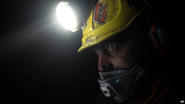Coal miner Jonny Sandvoll works at the bottom of the Gruve 7 coal mine in Adventdalen, Norway, Jan. 9, 2023.