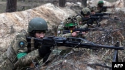 Ukrainian soldiers take part in military drills in Ukraine's eastern Donetsk region, Jan. 21, 2023, amid Russia's invasion of its neighbor. 