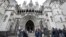FILE - Media wait outside the High Court in London, on March 18, 2021. 