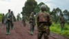 FILE - Congolese M23 rebels withdraw from an area in Kibumba, near Goma, North Kivu province of the Democratic Republic of Congo, Dec. 23, 2022.