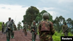 FILE - DRC M23 rebels withdraw from an area in Kibumba, near Goma, North Kivu province of DRC. Taken Dec. 23, 2022.