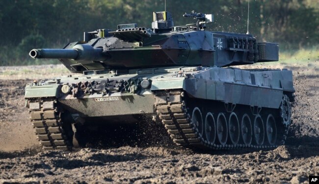 FILE - A Leopard 2 tank is pictured during a demonstration event held for the media by the German Bundeswehr in Munster near Hannover, Germany, Wednesday, Sept. 28, 2011. (AP Photo/Michael Sohn, File)